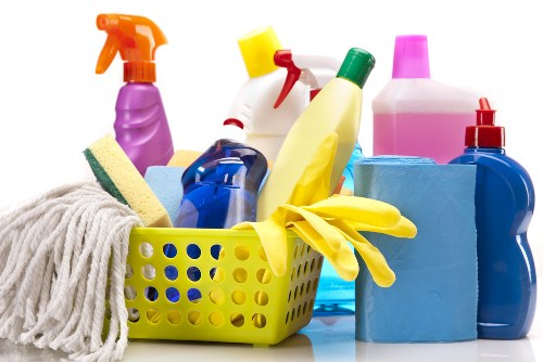 Cleaner tidying a kitchen as part of local Bayswater house cleaning